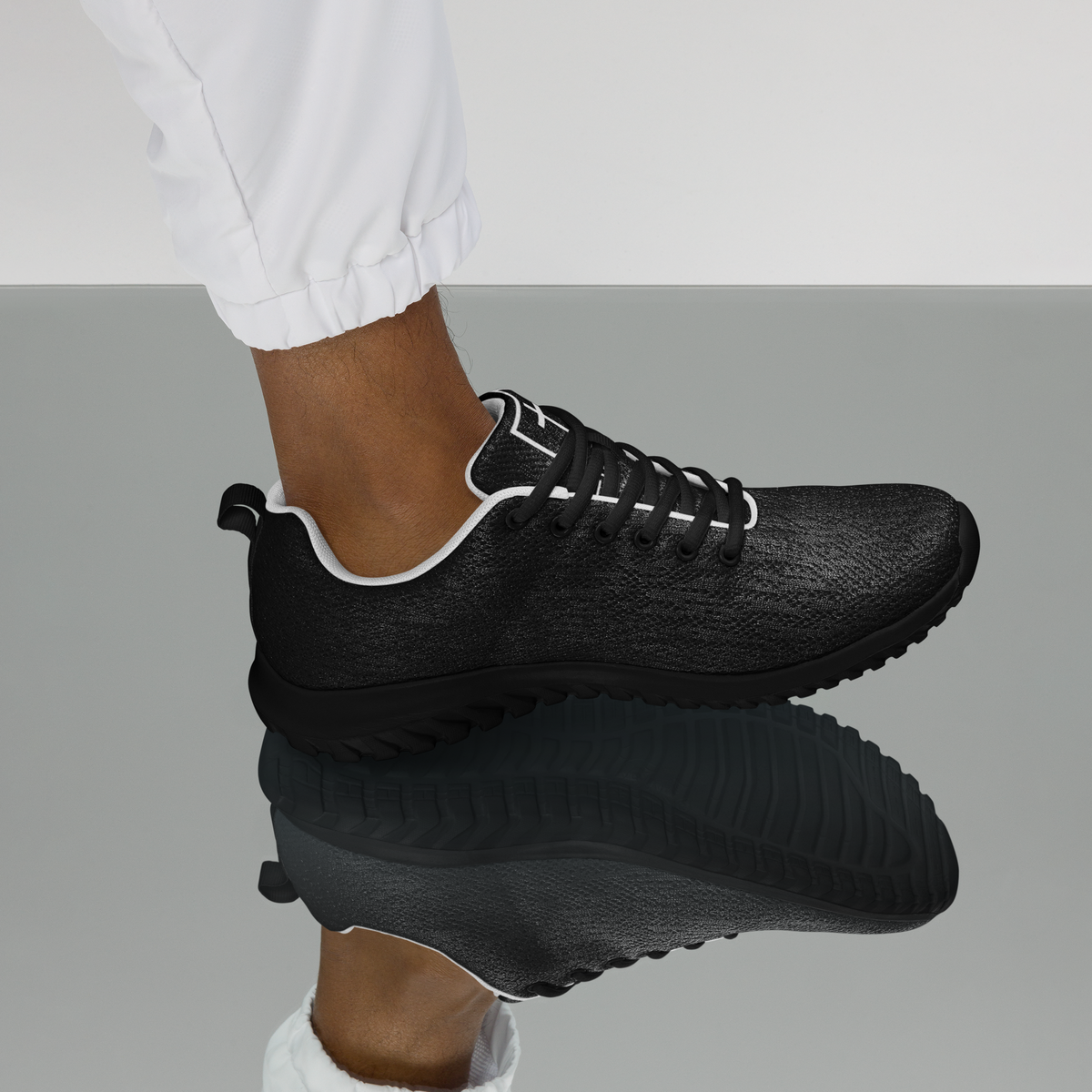 IX Lions Off-Field Trainers in black knit with cross logo on the tongue, left side view